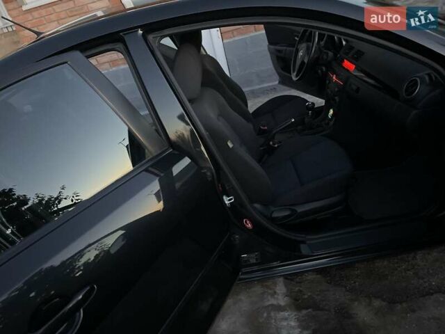 Черный Мазда 3, объемом двигателя 1.6 л и пробегом 173 тыс. км за 6300 $, фото 1 на Automoto.ua