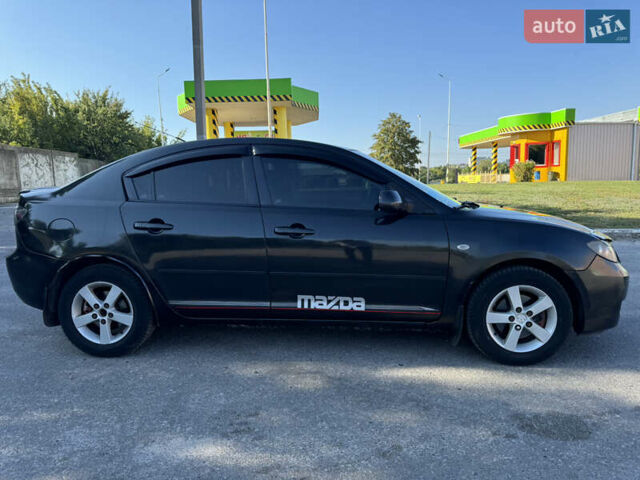 Черный Мазда 3, объемом двигателя 2 л и пробегом 150 тыс. км за 5999 $, фото 18 на Automoto.ua