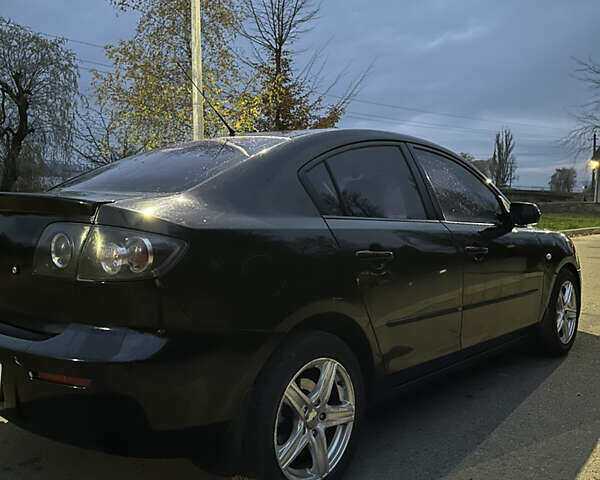 Черный Мазда 3, объемом двигателя 1.6 л и пробегом 208 тыс. км за 5500 $, фото 3 на Automoto.ua