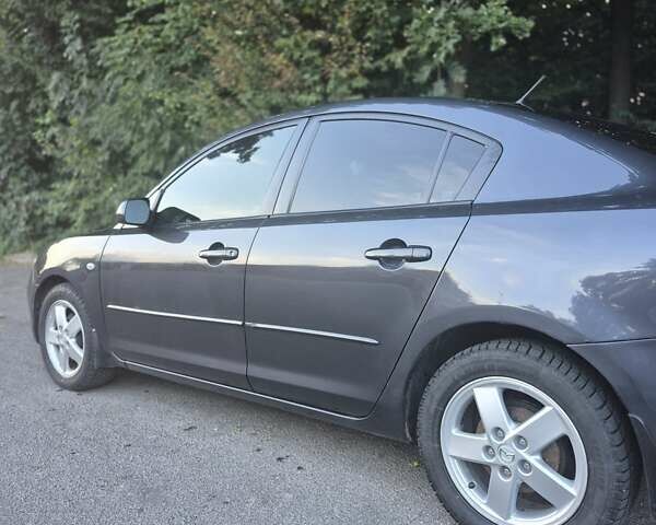 Чорний Мазда 3, об'ємом двигуна 1.6 л та пробігом 168 тис. км за 5600 $, фото 1 на Automoto.ua