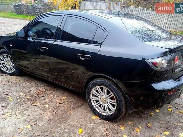 Черный Мазда 3, объемом двигателя 2 л и пробегом 240 тыс. км за 5600 $, фото 4 на Automoto.ua