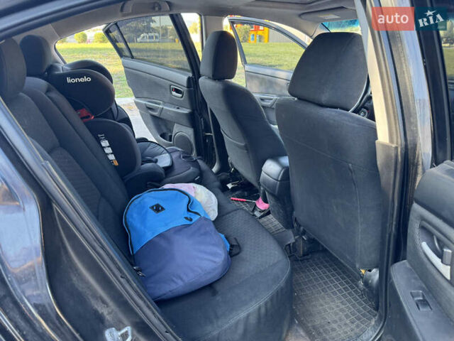 Черный Мазда 3, объемом двигателя 2 л и пробегом 150 тыс. км за 5999 $, фото 24 на Automoto.ua