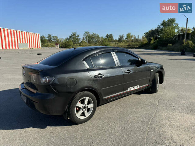Черный Мазда 3, объемом двигателя 2 л и пробегом 150 тыс. км за 5999 $, фото 11 на Automoto.ua