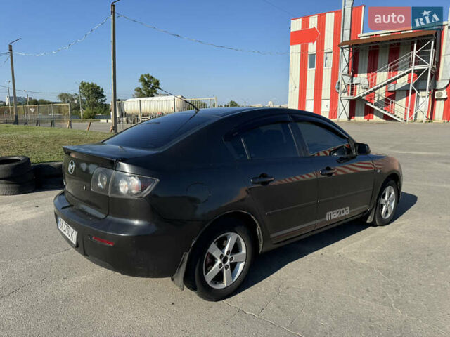 Черный Мазда 3, объемом двигателя 2 л и пробегом 150 тыс. км за 5999 $, фото 4 на Automoto.ua