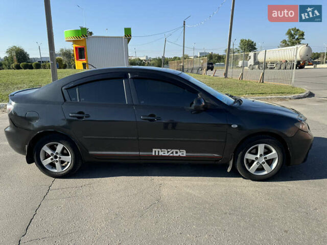 Черный Мазда 3, объемом двигателя 2 л и пробегом 150 тыс. км за 5999 $, фото 5 на Automoto.ua