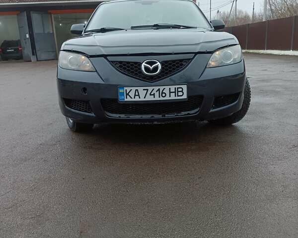 Черный Мазда 3, объемом двигателя 1.6 л и пробегом 232 тыс. км за 5850 $, фото 1 на Automoto.ua