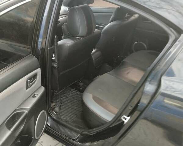 Черный Мазда 3, объемом двигателя 1.6 л и пробегом 300 тыс. км за 4500 $, фото 1 на Automoto.ua