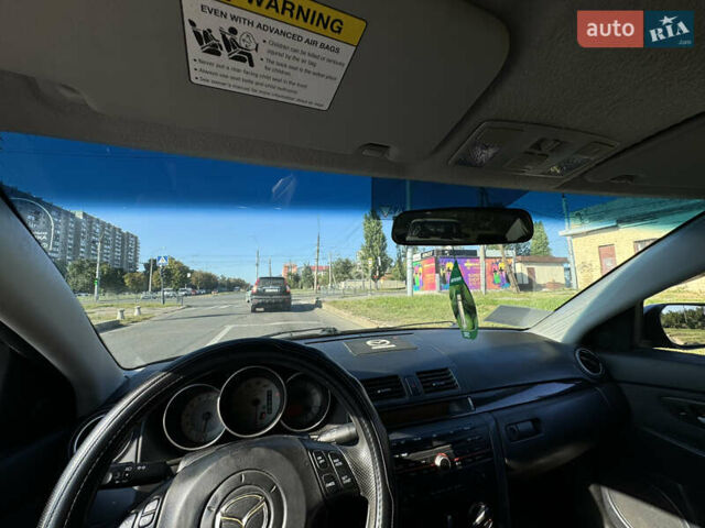 Черный Мазда 3, объемом двигателя 2 л и пробегом 150 тыс. км за 5999 $, фото 30 на Automoto.ua