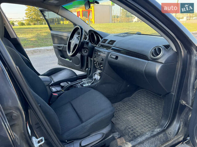 Черный Мазда 3, объемом двигателя 2 л и пробегом 150 тыс. км за 5999 $, фото 23 на Automoto.ua