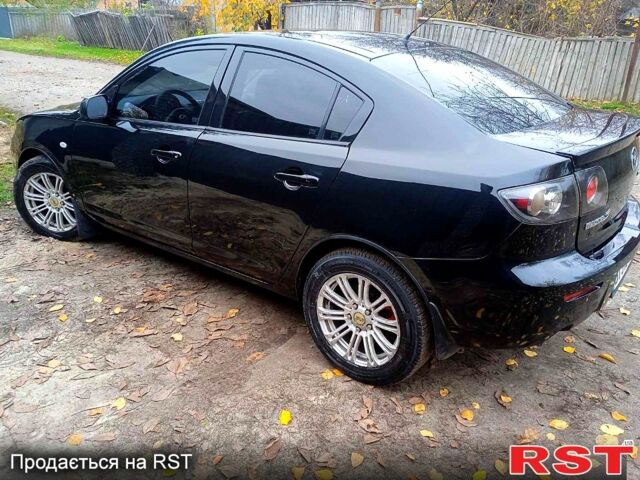 Черный Мазда 3, объемом двигателя 2 л и пробегом 240 тыс. км за 5600 $, фото 5 на Automoto.ua