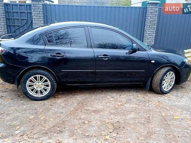 Черный Мазда 3, объемом двигателя 2 л и пробегом 240 тыс. км за 5600 $, фото 3 на Automoto.ua