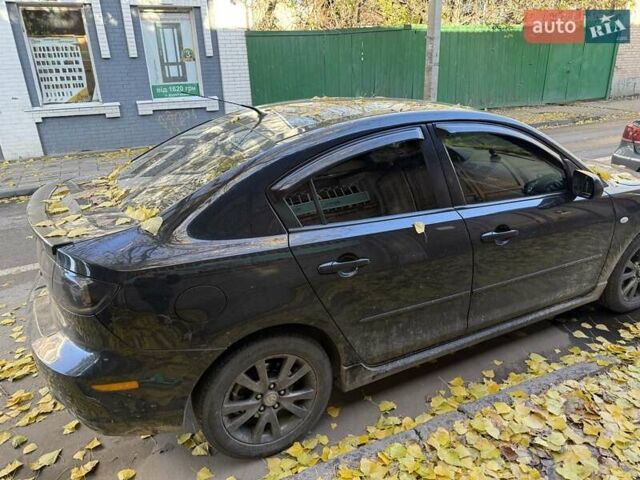 Черный Мазда 3, объемом двигателя 2 л и пробегом 218 тыс. км за 4000 $, фото 2 на Automoto.ua