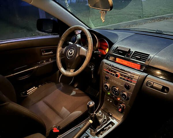 Черный Мазда 3, объемом двигателя 1.6 л и пробегом 208 тыс. км за 5500 $, фото 6 на Automoto.ua