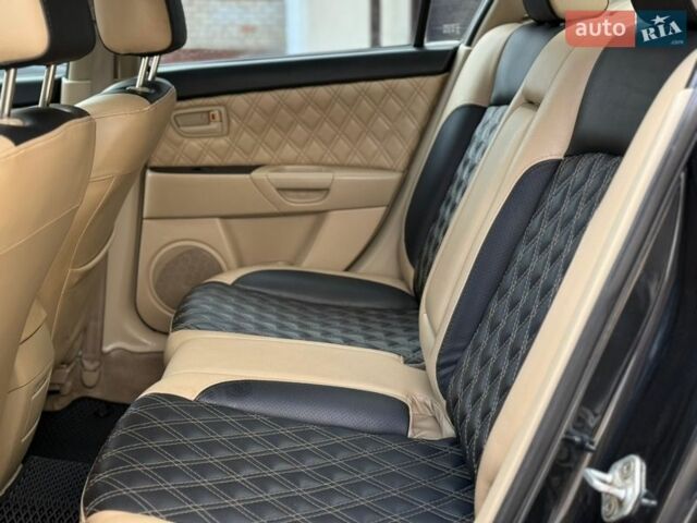 Чорний Мазда 3, об'ємом двигуна 1.6 л та пробігом 268 тис. км за 5750 $, фото 13 на Automoto.ua