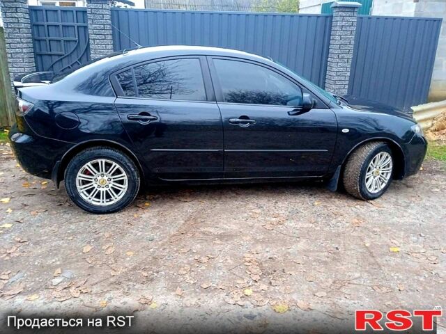 Черный Мазда 3, объемом двигателя 2 л и пробегом 240 тыс. км за 5600 $, фото 4 на Automoto.ua