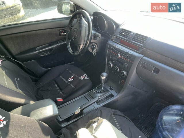 Черный Мазда 3, объемом двигателя 1.6 л и пробегом 330 тыс. км за 4500 $, фото 6 на Automoto.ua