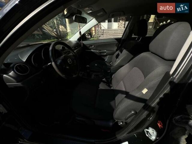 Черный Мазда 3, объемом двигателя 1.6 л и пробегом 310 тыс. км за 4800 $, фото 12 на Automoto.ua