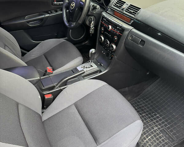 Черный Мазда 3, объемом двигателя 1.6 л и пробегом 255 тыс. км за 5650 $, фото 6 на Automoto.ua