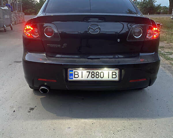 Черный Мазда 3, объемом двигателя 2 л и пробегом 204 тыс. км за 6700 $, фото 3 на Automoto.ua