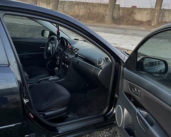 Черный Мазда 3, объемом двигателя 1.6 л и пробегом 153 тыс. км за 6200 $, фото 21 на Automoto.ua
