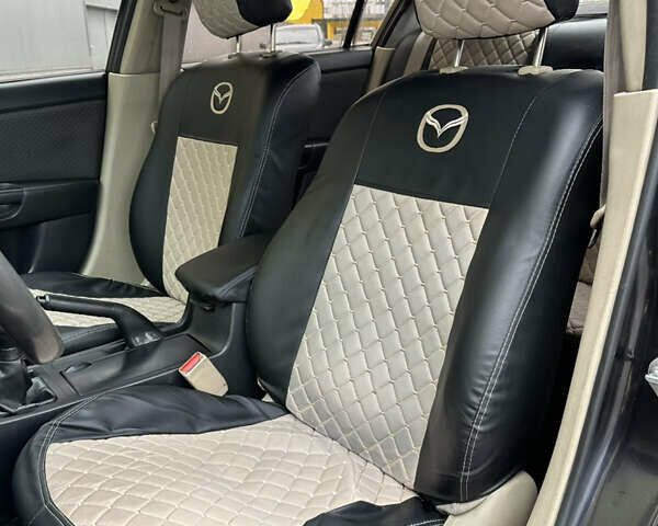 Черный Мазда 3, объемом двигателя 2 л и пробегом 200 тыс. км за 2700 $, фото 9 на Automoto.ua