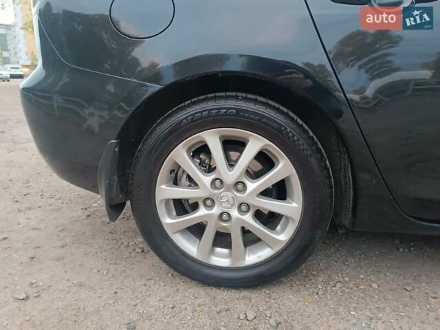 Черный Мазда 3, объемом двигателя 2 л и пробегом 221 тыс. км за 5700 $, фото 12 на Automoto.ua