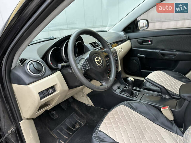 Черный Мазда 3, объемом двигателя 2 л и пробегом 200 тыс. км за 2700 $, фото 8 на Automoto.ua