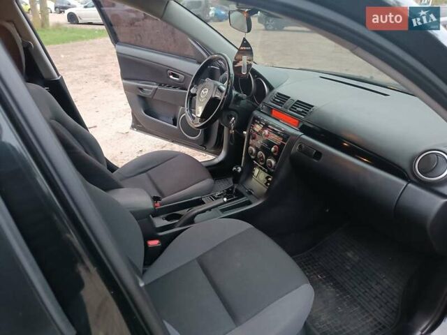 Черный Мазда 3, объемом двигателя 2 л и пробегом 221 тыс. км за 5700 $, фото 17 на Automoto.ua