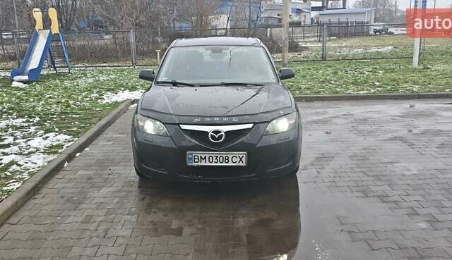 Черный Мазда 3, объемом двигателя 1.6 л и пробегом 205 тыс. км за 5600 $, фото 1 на Automoto.ua