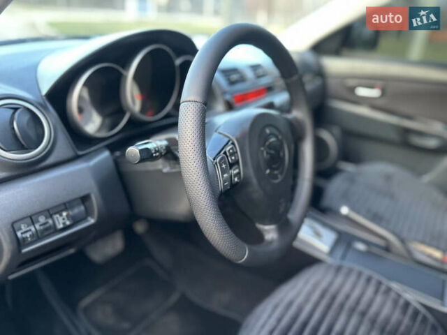 Чорний Мазда 3, об'ємом двигуна 1.6 л та пробігом 198 тис. км за 5499 $, фото 16 на Automoto.ua