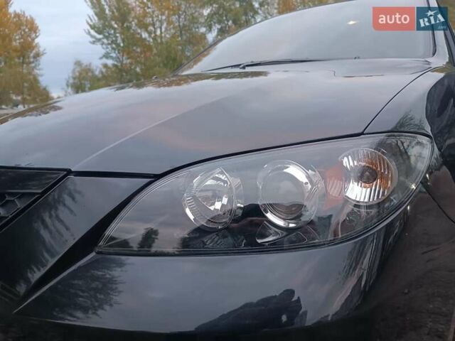 Черный Мазда 3, объемом двигателя 2 л и пробегом 221 тыс. км за 5700 $, фото 25 на Automoto.ua