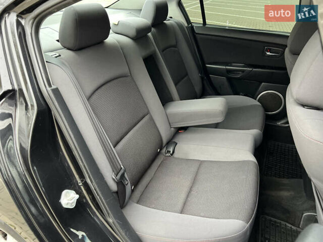 Черный Мазда 3, объемом двигателя 1.6 л и пробегом 256 тыс. км за 5450 $, фото 24 на Automoto.ua