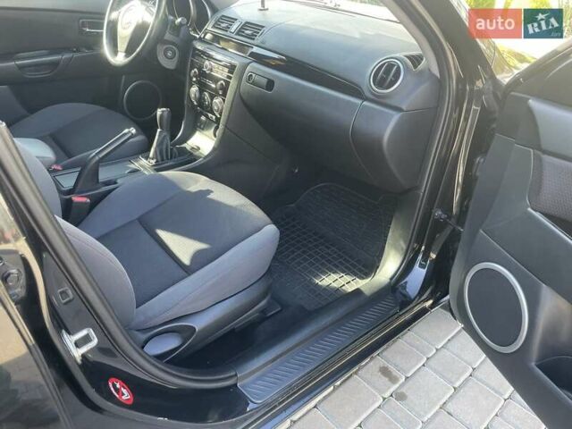 Черный Мазда 3, объемом двигателя 2 л и пробегом 175 тыс. км за 6000 $, фото 12 на Automoto.ua