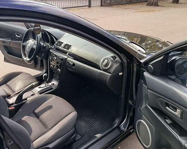 Черный Мазда 3, объемом двигателя 2 л и пробегом 199 тыс. км за 6800 $, фото 10 на Automoto.ua