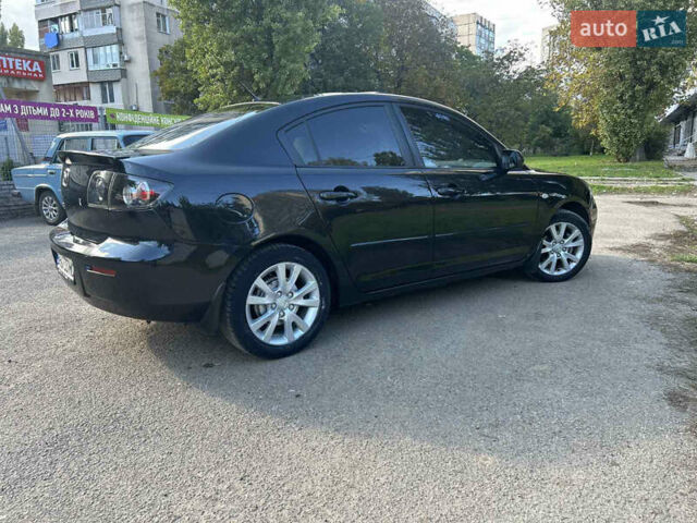 Черный Мазда 3, объемом двигателя 1.6 л и пробегом 153 тыс. км за 5500 $, фото 7 на Automoto.ua