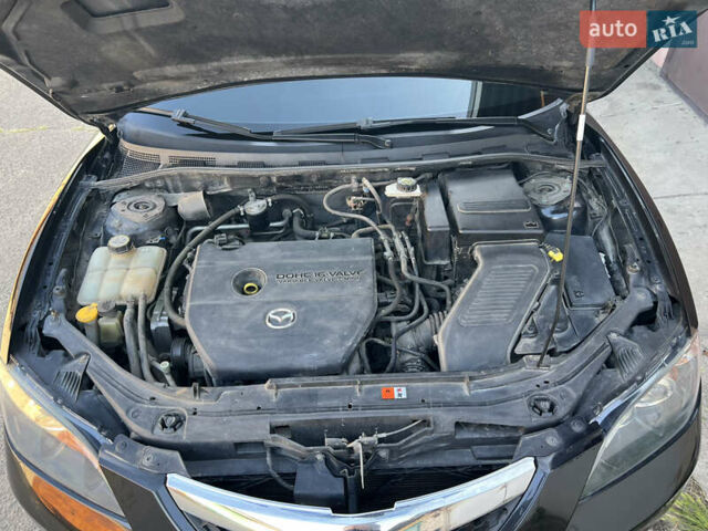 Чорний Мазда 3, об'ємом двигуна 2 л та пробігом 167 тис. км за 7500 $, фото 17 на Automoto.ua