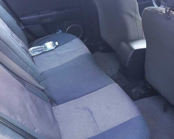 Черный Мазда 3, объемом двигателя 1.6 л и пробегом 121 тыс. км за 6000 $, фото 1 на Automoto.ua