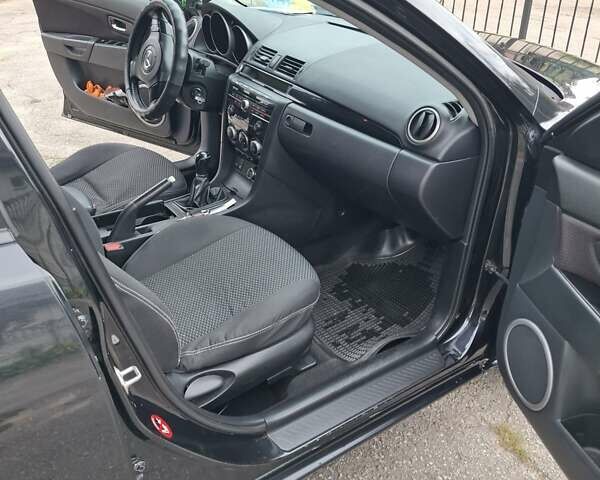 Чорний Мазда 3, об'ємом двигуна 1.6 л та пробігом 208 тис. км за 6600 $, фото 7 на Automoto.ua