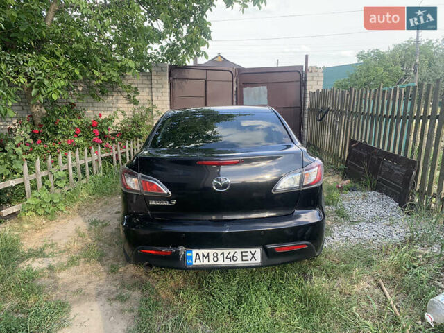 Черный Мазда 3, объемом двигателя 2 л и пробегом 165 тыс. км за 6500 $, фото 1 на Automoto.ua