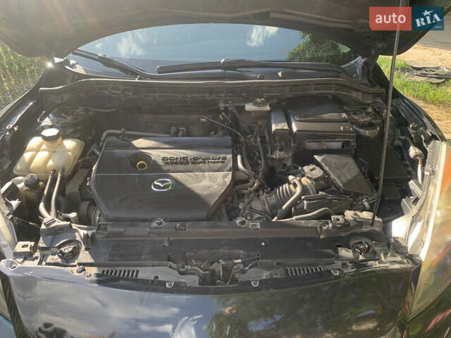 Черный Мазда 3, объемом двигателя 2 л и пробегом 165 тыс. км за 6500 $, фото 5 на Automoto.ua