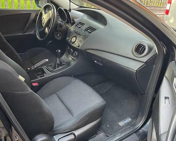 Чорний Мазда 3, об'ємом двигуна 1.6 л та пробігом 180 тис. км за 6900 $, фото 3 на Automoto.ua