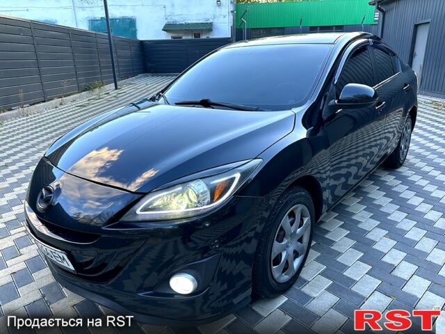 Черный Мазда 3, объемом двигателя 2 л и пробегом 280 тыс. км за 6950 $, фото 1 на Automoto.ua