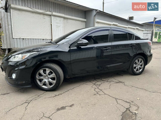 Черный Мазда 3, объемом двигателя 2 л и пробегом 280 тыс. км за 6700 $, фото 3 на Automoto.ua