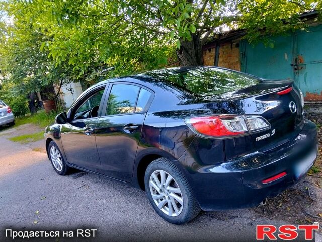 Черный Мазда 3, объемом двигателя 2 л и пробегом 225 тыс. км за 6900 $, фото 1 на Automoto.ua