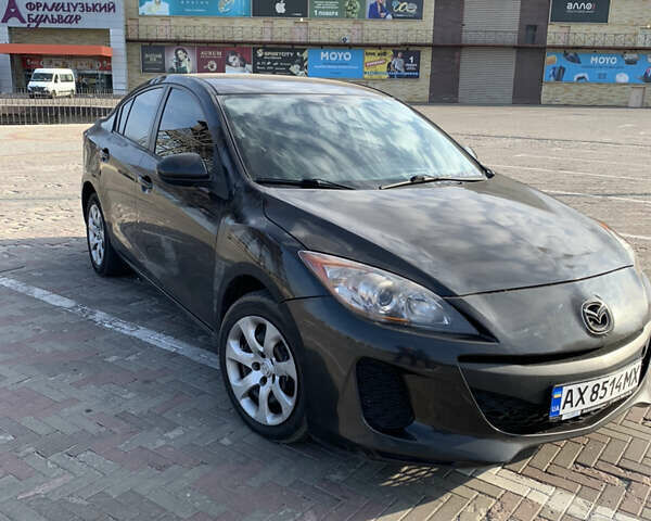 Черный Мазда 3, объемом двигателя 2 л и пробегом 196 тыс. км за 7200 $, фото 2 на Automoto.ua