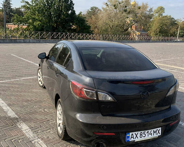 Черный Мазда 3, объемом двигателя 2 л и пробегом 196 тыс. км за 7200 $, фото 9 на Automoto.ua