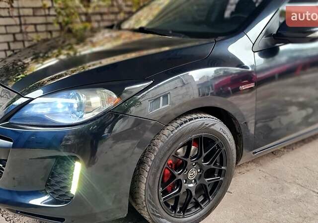 Черный Мазда 3, объемом двигателя 2 л и пробегом 189 тыс. км за 7700 $, фото 5 на Automoto.ua