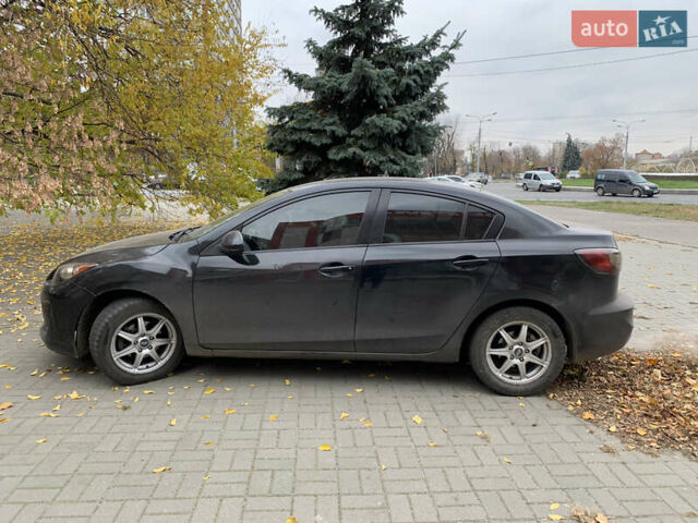 Черный Мазда 3, объемом двигателя 2 л и пробегом 196 тыс. км за 7200 $, фото 1 на Automoto.ua