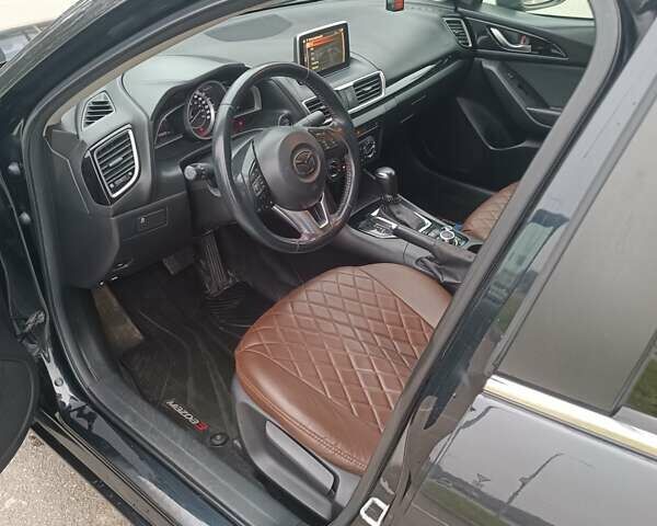 Черный Мазда 3, объемом двигателя 2 л и пробегом 128 тыс. км за 12700 $, фото 14 на Automoto.ua