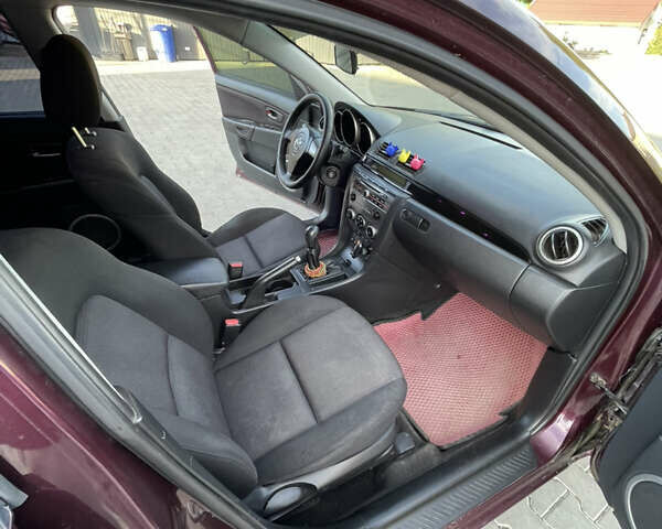 Фиолетовый Мазда 3, объемом двигателя 1.6 л и пробегом 270 тыс. км за 6250 $, фото 21 на Automoto.ua